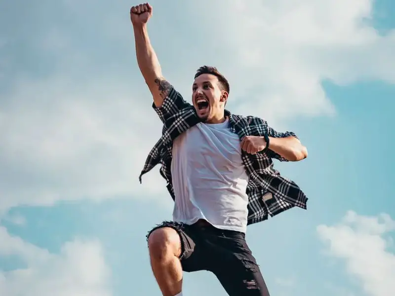 low angle photography of man jumping